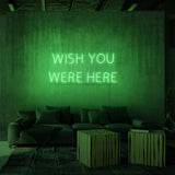 Rótulo de neón "WISH YOU WERE HERE"