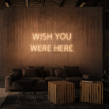 Rótulo de neón "WISH YOU WERE HERE"