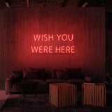 Rótulo de neón "WISH YOU WERE HERE"